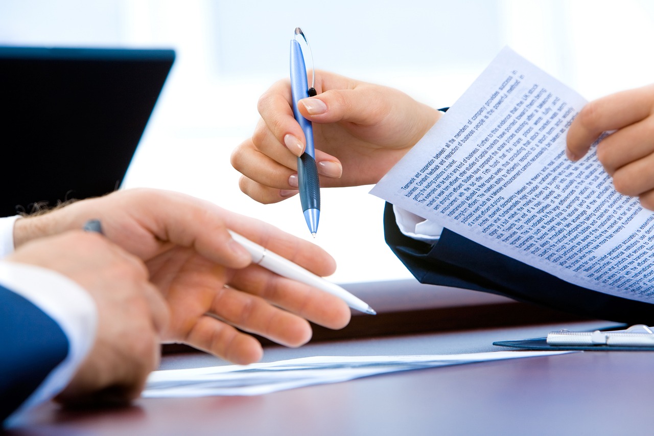 Two people about to discuss sign contract