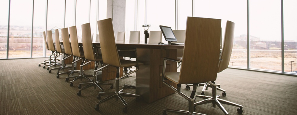 image-of-board-room-table-to-highlight-shift-of-cyber-risk-from-being-IT-issue-to-being-an-company-one